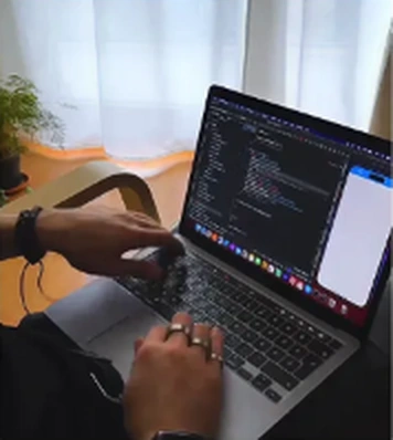Developer coding on a laptop